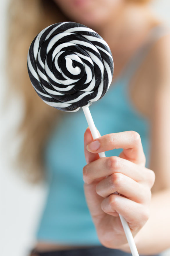 Girl with Black and White Lollipop
