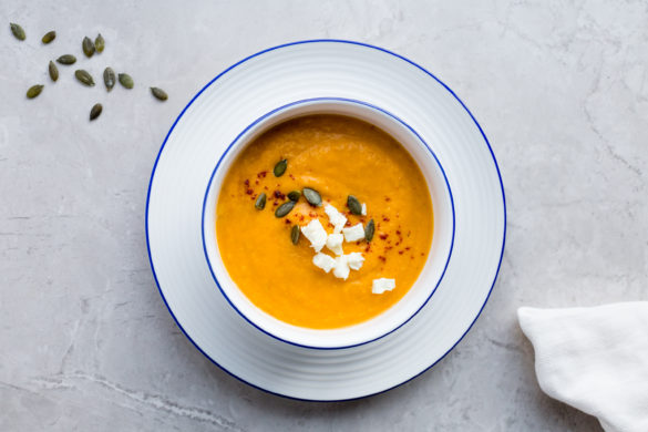 Butternut Squash Soup in bowl on marble table